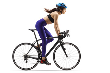 Wall Mural - Fit young woman riding a bicycle with a helmet