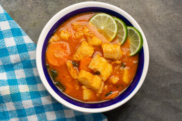 Sticker - Fish soup with vegetables on grey background. Mexican food