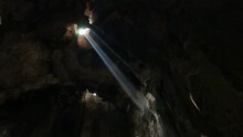 Bright Sun Beam From Hole At Cave Ceiling