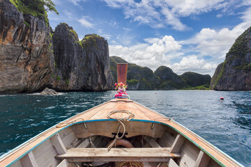 Wall Mural - raditional longtail boat with beautiful scenery view at Maya Bay on Phi Phi Leh Island in sunshine day