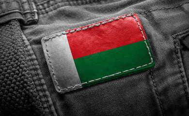 Tag on dark clothing in the form of the flag of the Madagascar