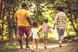 © liderina - African American family having fun outdoors.