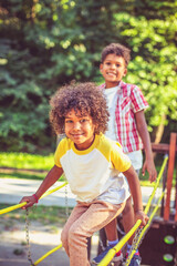 Wall Mural -  African American kids playing on bridge.