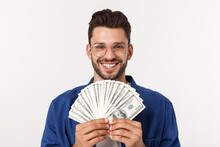 Attractive Man Is Holding Cash Money In One Hand, On Isolated White Background