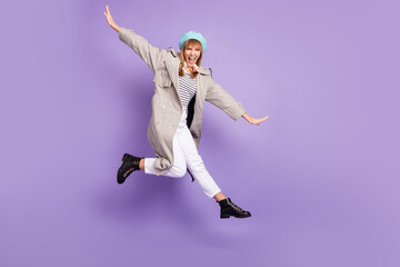 Sticker - Photo of lady raise hands have fun jump open mouth wear blue beret coat isolated violet color background