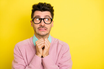 Canvas Print - Photo of young man afraid scared nervous worried fail look empty space isolated over yellow color background