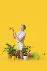 Sticker - Young female gardener on color background