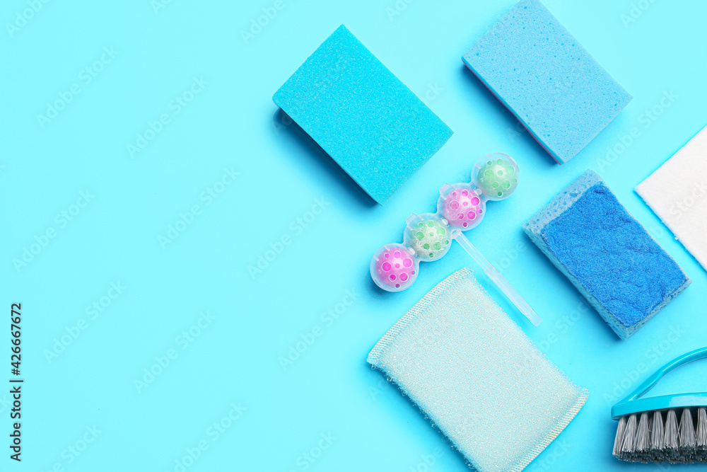 Set of cleaning supplies on color background