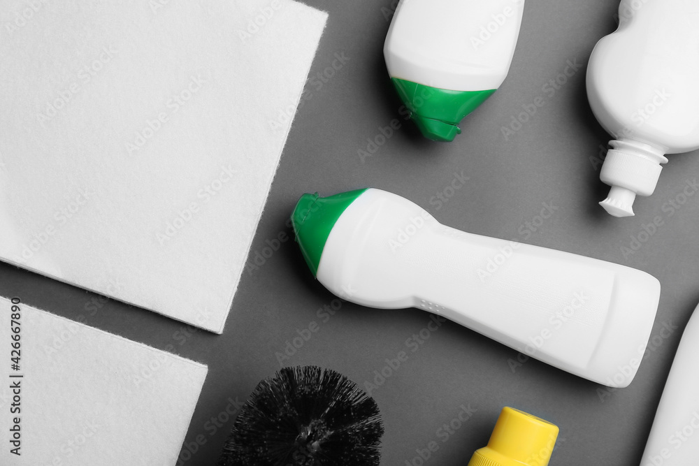 Set of cleaning supplies on dark background