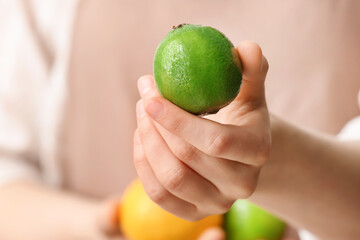 Female hand with lime, closeup