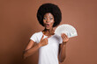© deagreez - Photo portrait of woman pointing finger money cash dollar banknotes amazed happy overjoyed rich isolated on brown color background
