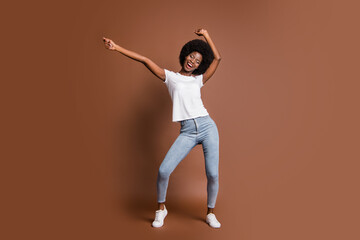 Canvas Print - Full length body size photo of cheerful happy girl dancing on weekends in stylish outfit isolated on brown color background