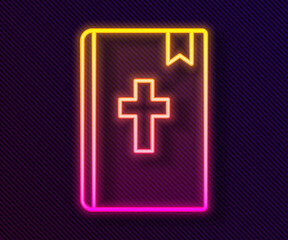 Glowing neon line Holy bible book icon isolated on black background. Vector