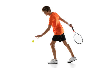 Wall Mural - Young Caucasian man, tennis player posing isolated on white background.