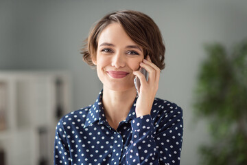 Sticker - Portrait of attractive pretty cheerful brown-haired girl calling client discussing project order interview at workplace workstation indoors