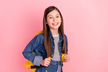 Canvas Print - Photo portrait of little girl with rucksack laughing in jeans clothes isolated on pastel pink color background