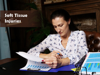 Business concept about Soft Tissue Injuries Businesswoman, executive manager hand filling paper business document