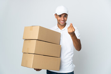 Delivery Brazilian man isolated on white background making money gesture