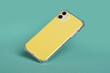 © iso100production - Yellow iPhone 11 in clear silicone case falls down isolated on green background back view. Phone case mockup