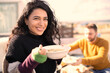 © Sam Edwards/Caia Image - Portrait happy woman eating on sunny patio