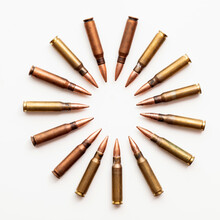 A Group Of Bullet Ammunition Shells In A Circle On A White Background