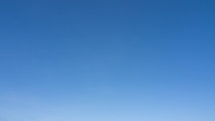 Wall Mural - 4k time lapse, clear sky with wispy clouds nature background, blue sky with clouds. daytime environm
