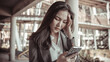 © Puwasit Inyavileart - Young woman in a gray suit looks tense over working on a smartphone, Young business woman is stressed by work because the data sent from the smartphone is wrong, Anxious, Sad, Wrong, Depressed.