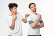 © SHOTPRIME STUDIO - two men in white t-shirts are standing side by side isolated background
