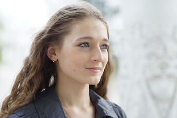 Portrait of a young beautiful girl in the park