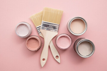 Wall Mural - Overhead view of a DIY paint brush with pastel pink sample paint pots