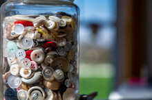 Assortment Random Colored Loose Buttons In A Glass Jar