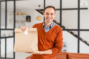 Canvas Print - Diverse of paper containers for takeaway food. Delivery man is carrying