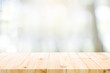 © ijeab - Empty wooden table for present product on coffee shop blur background.