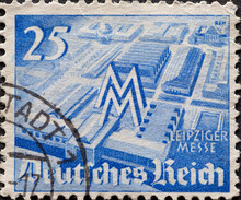 GERMANY - CIRCA 1940: A Postage Stamp From Germany, Showing The Exhibition Halls Of The Leipziger Messe With The Trade Fair Symbol