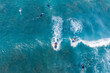 Aerial Top down view of surfers on body boards riding on waves, Hawaii