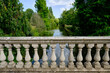 View of Italian Palladio balustrade in the foreground and beautiful forest and river in the background.