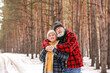 © Pixel-Shot - Happy mature couple in forest on winter day