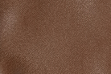 Cognac textured smooth leather surface background, medium grain