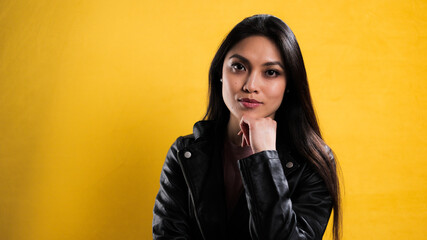 Wall Mural - Portrait of a young beautiful woman against a neutral background - studio photography