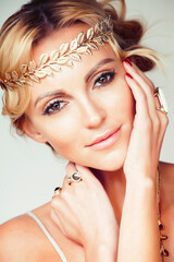 Poster - young blond woman dressed like ancient greek godess, gold jewelry close up isolated, summer trends