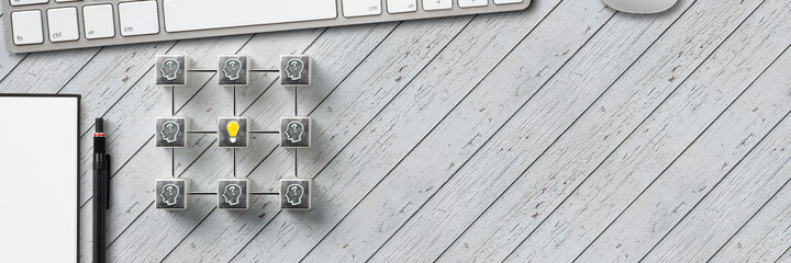 Wall Mural - cube grid with idea creation process and notepad and pen on wooden background