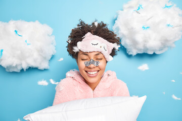 happy curly afro american woman gets rid of black dotes on nose using special patch wants to have fl