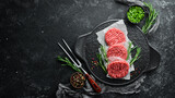 Fototapeta Mapy - Raw cutlets for a burger with spices. Meat. Top view. Free space for your text.