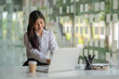 © Songsak C - Portrait of a pretty young woman using her laptop in the office.