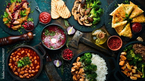 Obraz Dibond Food. Set of dishes on the table. On a wooden background. Top view. Copy space.