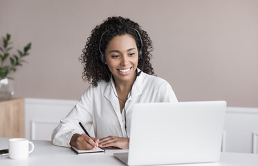 Wall Mural - Distance studying, e-learning concept. Woman using laptop computer at home, study online. Student girl working in her room. Work or studying from home, business, creative occupation, meeting online