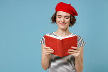 Young Happy Smiling Smart Student Woman 20s With Short Hairdo Wearing French Beret Red Hat Striped T-shirt Hold Diary Read Book Novel Visit Library Isolated On Pastel Blue Background Studio Portrait.
