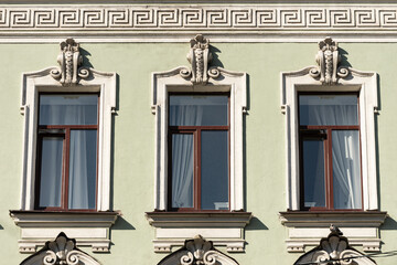 Windows on old city facades, with decorative elements