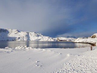 Wall Mural - Snowy mountain and blue fjord lanscape in the arctic circle