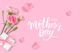 Fototapeta Tulipany - Happy Mothers day. Calligraphic greeting text. Holiday design template with realistic pink carnation flowers, gift box and paper hearts on pink background. Vector stock illustration.